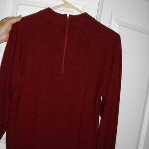 Women's Designer Originals burgundy long sleeved sweater, size medium. Back zip.